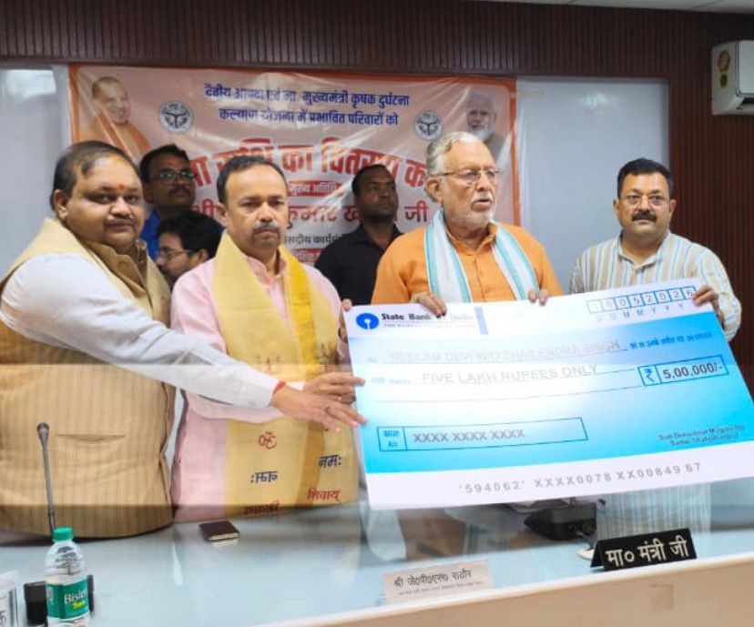 Finance minister distributes cheques to needy families