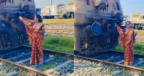 रील के लिए किया जोखिम भरा स्टंट..रेलवे ट्रैक पर ट्रेन से साड़ी का पल्लू बांधकर नाचने लगी महिला, देखें …
